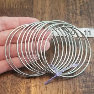 Lot of 11 silver tone bangles